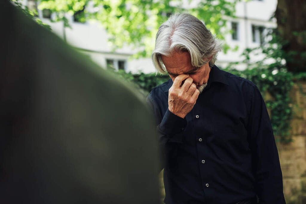 A sad older person