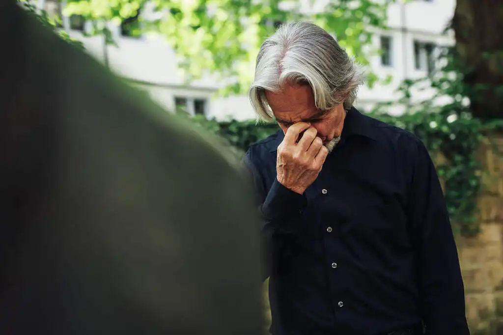 A sad older person