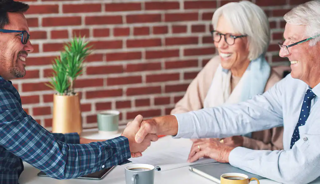 Senior couple happy with their financial advisory service
