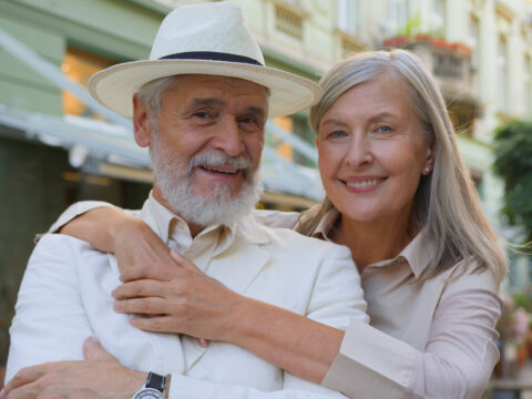 Happy retired couple in Boca Raton planning their RMD strategy with a fee-only advisor.